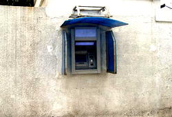Robbers attack bank, cart away Automated Teller Machines