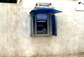 Robbers attack bank, cart away Automated Teller Machines