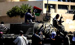 Gadhafi’s days numbered says White House as Libyan rebels free prisoners in Tripoli