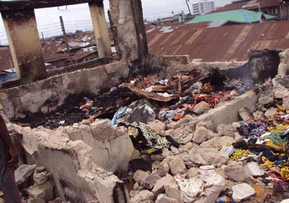 Fire victims count losses, mourn dead colleagues