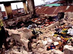 Fire victims count losses, mourn dead colleagues
