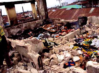 Fire victims count losses, mourn dead colleagues