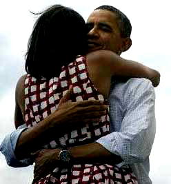 Obama hugs Michelle, and makes Facebook history