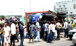 Three feared dead as container falls off truck