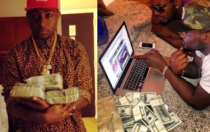 Photo: Davido, Jude Okoye flaunt stacks of dollar bills