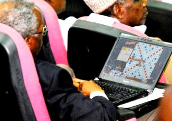 Confab delegate plays scrabble during session