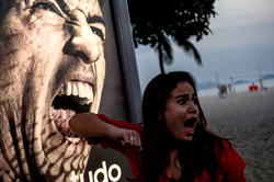 Photo op and fury at Suarez ‘bite’ billboard