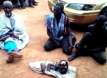 4 men remove human parts from grave