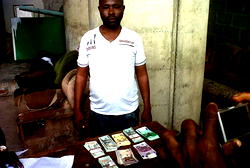 Man arrested with fake $100, £100 notes