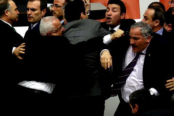 Fists fly in a rowdy 18-hour session in Turkish parliament