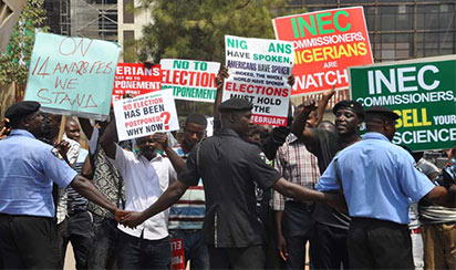 Group protest plan to postpone elections in Abuja - Vanguard News