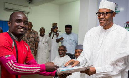Suleiman Hashimu, Lagos to Abuja trekker meets Buhari in Abuja