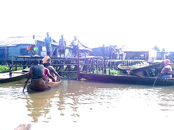 How women earn living ferrying commuters across Bayelsa waters
