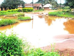 Flood ravages Edo-Delta link road, cuts off Alihame community