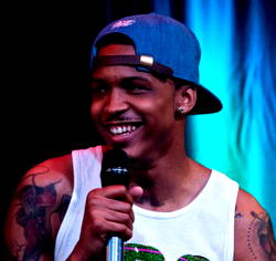 Video: Rapper August Alsina fondles fan’s boobs on stage