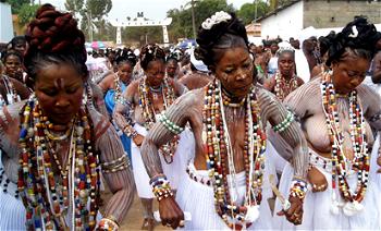 Bare-chested women dance, trance Togo mysterious sacred stone