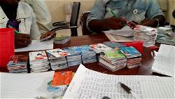 Four arrested with 4,555 National Identity cards allegedly given to them by INEC staff
