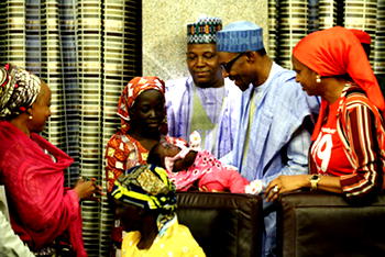 Amina’s Boko Haram ‘husband’ calm, cuddles their baby