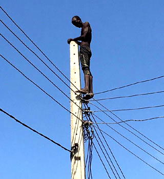 Photos: Man attempts suicide, climbs electric pole in Lagos