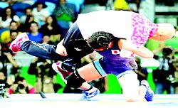 Female wrestler goes wild  after winning gold