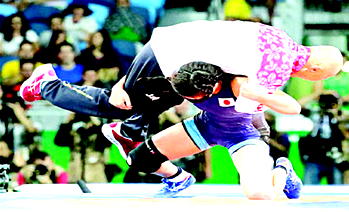 Female wrestler goes wild  after winning gold