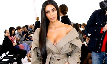 Photos: Kim Kardashian attends Paris Fashion Week without makeup,bra