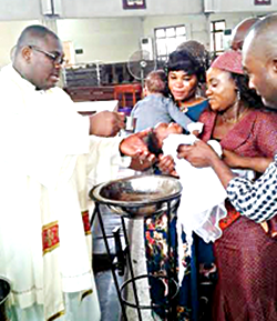 Catholic Church baptises 13 infants