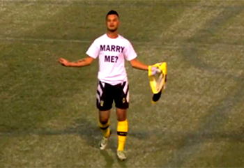 Video: Soccer player booked for making marriage proposal mid-game