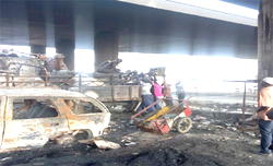 Coconut tanker fire: Scavengers take over as angry business owners mourn their losses