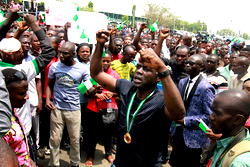 Photos: Youths in Abuja welcome President Muhammadu Buhari