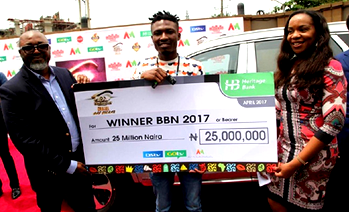 Photos: #BBNaija winner, Efe receives his N25m cheque, Kia SUV