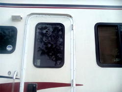 Photos: Dino Melayes  security car, caravan, wall riddled with bullets