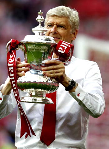 A football team is like a beautiful woman, Arsene Wenger quotes