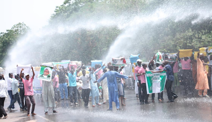 Police Tear Gas El-Zakzaky Protesters in Abuja with Water Canons.