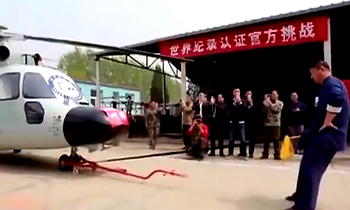 Kung fu master tows military helicopter with manhood, breaks record