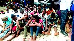 Police parade 100 robbery, child trafficking suspects in Anambra