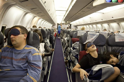 13 Easy Tips for Overnight Flights: How to Sleep on a Plane