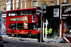 Bus crashes into building, trapping two passengers