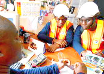 Total leads 55 students on tour of work environment