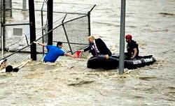 Trending photo: President Trump jumps into boat, rescues victims of Hurricane