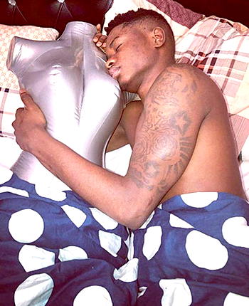 Lil Kesh cuddling a doll sets the internet in frenzy