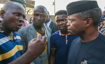 Osinbajo, ever attentive, listens to one of the leaders