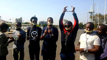 Breaking: Charly Boy group protests in handcuffs, chains over Libya slave trade