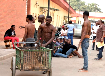 Lagos arrests cart pushers, residents for dumping waste on road medians, canals