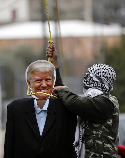 Photos: Palestinians hang puppet bearing  US President Trump’s portrait