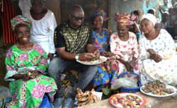 Photos: Fayose having fun with market women, buys kolanuts
