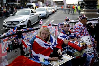 Divided Britain unites for royal wedding revelry