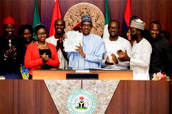 Photos: President Buhari signs into Law the Not Too Young To Run Bill