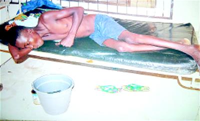 The late Dominic vomiting blood at his hospital bed before his death.