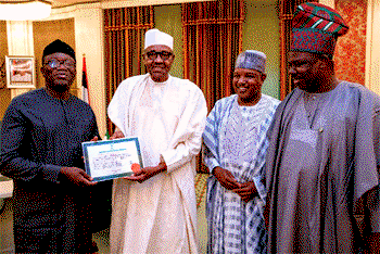 Photo: Fayemi presents certificate to president Buhari